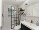 Modern bathroom featuring black and white tile, glass shower and a plant decor at 233 Spence Se Ave, Atlanta, GA 30317