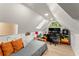 Cozy bedroom featuring a sloped ceiling, skylight, and built in workspace at 233 Spence Se Ave, Atlanta, GA 30317