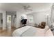 Bright bedroom featuring hardwood floors, a ceiling fan, and a dedicated workspace area at 233 Spence Se Ave, Atlanta, GA 30317