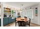 Cozy dining area with a round wooden table and built-in shelving with natural light at 233 Spence Se Ave, Atlanta, GA 30317