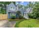 Inviting blue home with a well-maintained yard and a charming walkway leading to the front entrance at 233 Spence Se Ave, Atlanta, GA 30317