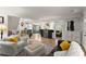 Spacious open-plan living area featuring hardwood floors, neutral decor, and seamless transitions to the kitchen at 233 Spence Se Ave, Atlanta, GA 30317