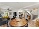 Open concept living space with dining area, living room, and staircase at 233 Spence Se Ave, Atlanta, GA 30317