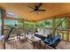 Relaxing screened porch with comfortable seating, a ceiling fan, and a treadmill at 233 Spence Se Ave, Atlanta, GA 30317