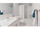 Bathroom featuring single vanity with cultured marble countertops, tub with shower, and tile floors at 3334 Swallowtail Ter, Duluth, GA 30096