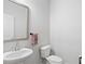 Bathroom features a vanity with cultured marble countertops and toilet at 3334 Swallowtail Ter, Duluth, GA 30096