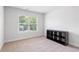 Bedroom with a window and an open shelving unit perfect for storage or decor at 3334 Swallowtail Ter, Duluth, GA 30096