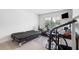 Bedroom featuring a futon and exercise equipment, perfect for a home gym at 3334 Swallowtail Ter, Duluth, GA 30096