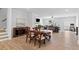 Open concept dining area with hardwood floors and elegant furniture at 3334 Swallowtail Ter, Duluth, GA 30096