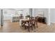 Spacious dining area with hardwood floors and a view of the kitchen at 3334 Swallowtail Ter, Duluth, GA 30096