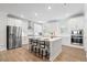 Bright kitchen with a center island, white cabinetry, and stainless steel appliances at 3334 Swallowtail Ter, Duluth, GA 30096