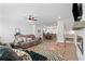 Cozy living area with a fireplace, ceiling fan, and hardwood floors at 3334 Swallowtail Ter, Duluth, GA 30096