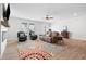 Bright living room with a ceiling fan, fireplace, and hardwood floors at 3334 Swallowtail Ter, Duluth, GA 30096