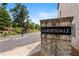 Elegant brick entrance to Gardendale community with beautifully landscaped surroundings at 3334 Swallowtail Ter, Duluth, GA 30096