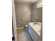 Bright bathroom features a white double sink vanity and large mirror, offering functionality and style at 5119 Hill Farm Ne Dr, Woodstock, GA 30188