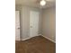 Cozy bedroom with neutral walls, soft carpet, and ample natural light at 5119 Hill Farm Ne Dr, Woodstock, GA 30188