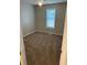 Comfortable bedroom featuring carpet flooring and a bright window at 5119 Hill Farm Ne Dr, Woodstock, GA 30188