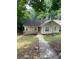 Cozy one-story home featuring a quaint front deck and traditional siding at 5119 Hill Farm Ne Dr, Woodstock, GA 30188