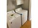Convenient laundry area equipped with a washing machine and dryer at 5119 Hill Farm Ne Dr, Woodstock, GA 30188