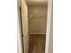 Spacious walk-in closet with ample shelving and neutral carpeting for organized storage at 5119 Hill Farm Ne Dr, Woodstock, GA 30188