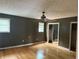 Bedroom with hardwood floors, ceiling fan, and closet with mirrored doors at 6649 Valley Hill Sw Dr, Mableton, GA 30126