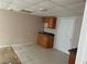Kitchen with cabinets, tile floor, and a white door at 6649 Valley Hill Sw Dr, Mableton, GA 30126
