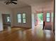 Open living room with wood floors, front door and access to basement at 6649 Valley Hill Sw Dr, Mableton, GA 30126
