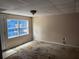 Living room with a window and stained floors at 6649 Valley Hill Sw Dr, Mableton, GA 30126