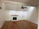 Open living room with hardwood floors, stone fireplace, and vaulted ceilings at 6649 Valley Hill Sw Dr, Mableton, GA 30126