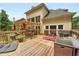 Spacious back deck with multiple seating options, hot tub, pergola and a grill at 185 Beracah Sw Walk, Atlanta, GA 30331