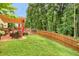 Exterior shot of backyard featuring a yard with a wooden fence and seating area at 185 Beracah Sw Walk, Atlanta, GA 30331