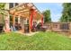 Exterior shot of backyard featuring a yard with a wooden fence and seating area at 185 Beracah Sw Walk, Atlanta, GA 30331