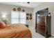 Well-lit bedroom with a comfortable bed, ample storage space, and tasteful decor for a relaxing retreat at 185 Beracah Sw Walk, Atlanta, GA 30331