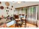 Bright breakfast nook features a glass table, comfortable seating, and natural light, perfect for casual dining at 185 Beracah Sw Walk, Atlanta, GA 30331