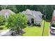 An aerial view of a brick home with manicured lawn and some shrubs at 185 Beracah Sw Walk, Atlanta, GA 30331