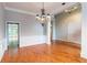 Open-concept floor plan boasts hardwood floors and classic chandelier, perfect for entertaining guests at 185 Beracah Sw Walk, Atlanta, GA 30331