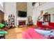 Open living room with hardwood floors and red couch at 185 Beracah Sw Walk, Atlanta, GA 30331