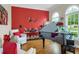 A music room with a baby grand piano, comfortable chairs, and lots of natural light at 185 Beracah Sw Walk, Atlanta, GA 30331
