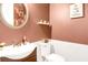Powder room featuring a white commode and sink at 185 Beracah Sw Walk, Atlanta, GA 30331