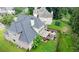 Aerial view of the rear exterior with a large deck, a covered patio, and a grassy backyard at 185 Beracah Sw Walk, Atlanta, GA 30331