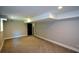 Finished basement featuring neutral walls and carpet, and a doorway to another space at 2116 Strasburg Ct, Atlanta, GA 30338