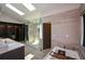 Bathroom featuring a glass shower, closet and a luxurious soaking tub at 2116 Strasburg Ct, Atlanta, GA 30338