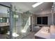 Modern bathroom showcasing a spacious glass shower, double vanity, and soaking tub at 2116 Strasburg Ct, Atlanta, GA 30338