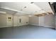 Spacious two car garage with white walls, gray flooring, and a separate entrance door at 2116 Strasburg Ct, Atlanta, GA 30338