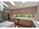 Sleek kitchen with stainless steel appliances, granite countertops, and a large window overlooking the yard at 2116 Strasburg Ct, Atlanta, GA 30338