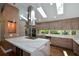 Open kitchen featuring a central island with a cooktop, stainless hood, and stainless appliances at 2116 Strasburg Ct, Atlanta, GA 30338