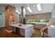 Modern kitchen with stainless steel appliances, quartz countertops, and ample natural light from skylights at 2116 Strasburg Ct, Atlanta, GA 30338