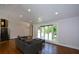 Spacious living room featuring hardwood floors, recessed lighting, and a large bay window offering scenic outdoor views at 2116 Strasburg Ct, Atlanta, GA 30338