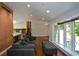Open living area with large windows, hardwood floors, recessed lighting, and easy access to the staircase at 2116 Strasburg Ct, Atlanta, GA 30338