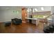 Open-concept living room and kitchen with hardwood floors and skylights at 2116 Strasburg Ct, Atlanta, GA 30338